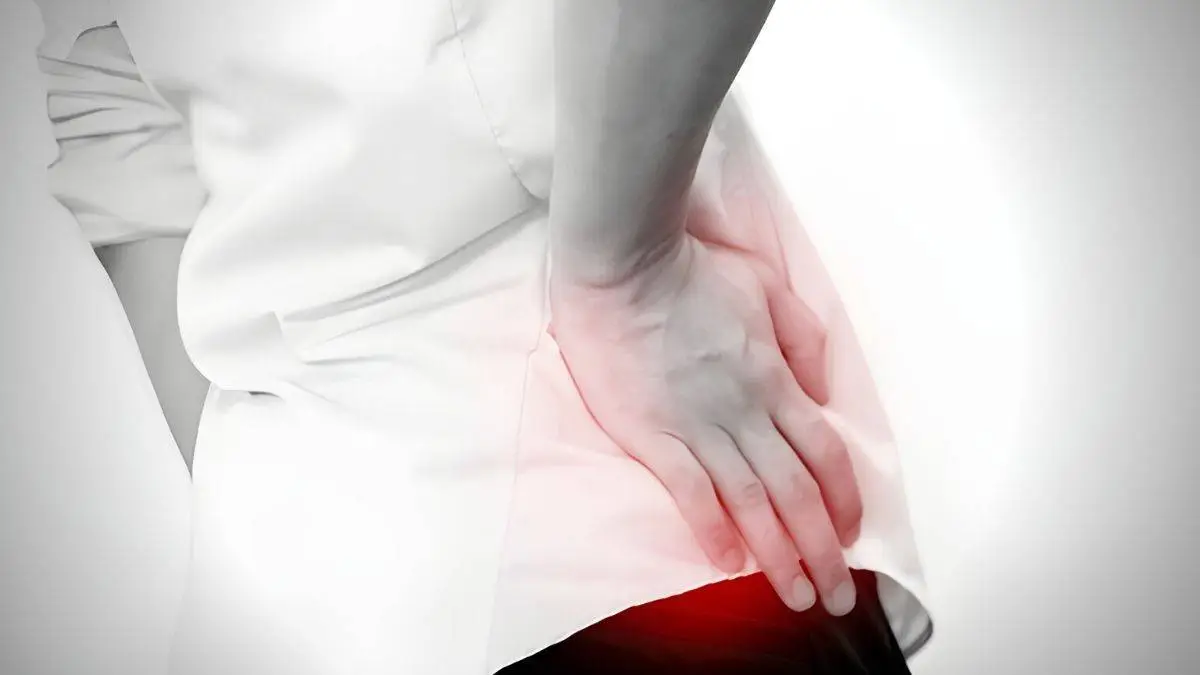 Photo of woman holding hip pinpointing area of pain