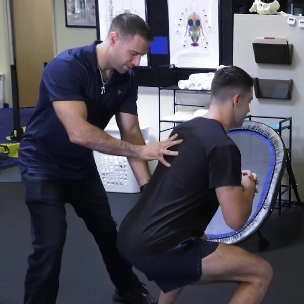 Dr. Joe Camisa using motion science to assist an athlete