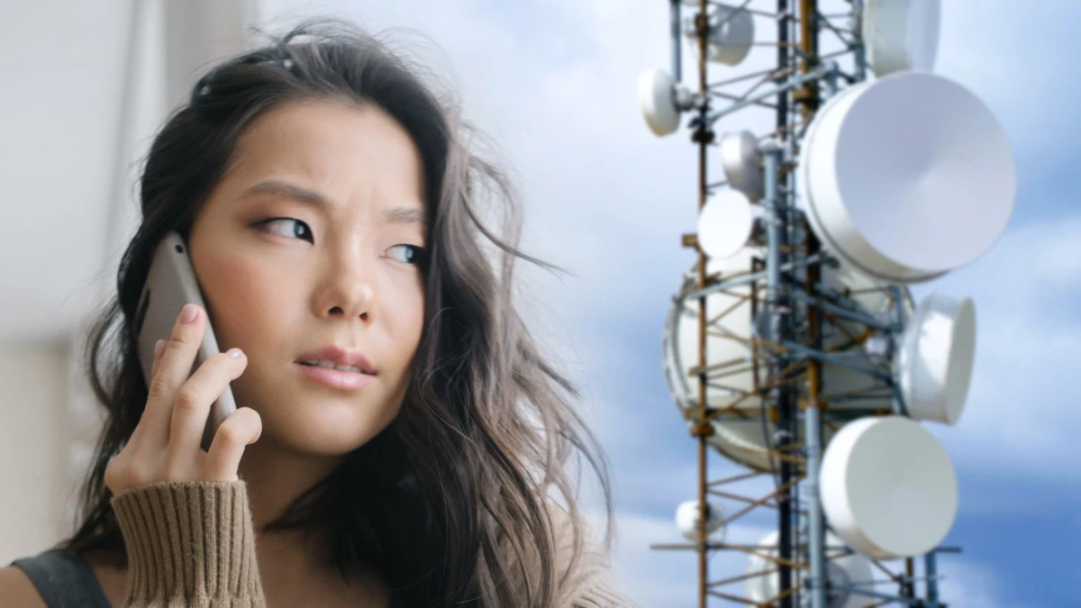 Woman on mobile phone concerned about cell tower radiation